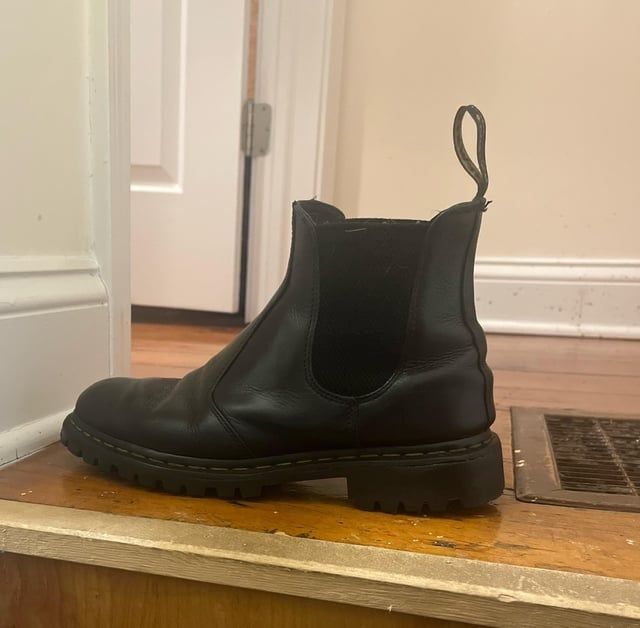 Black leather boot with stitched welt and thick lugged sole